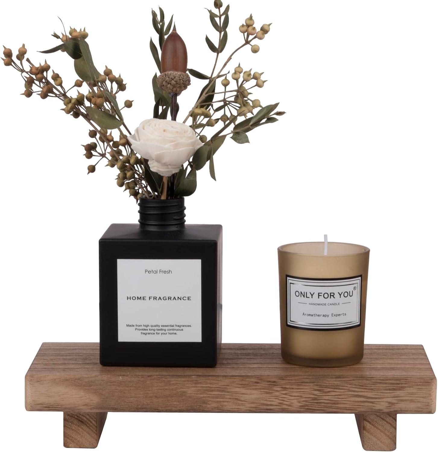 Small rustic wood farmhouse bathroom decor tray on a counter styled with a candle, black diffuser vase, dried greenery, and soft neutral vanity accents.