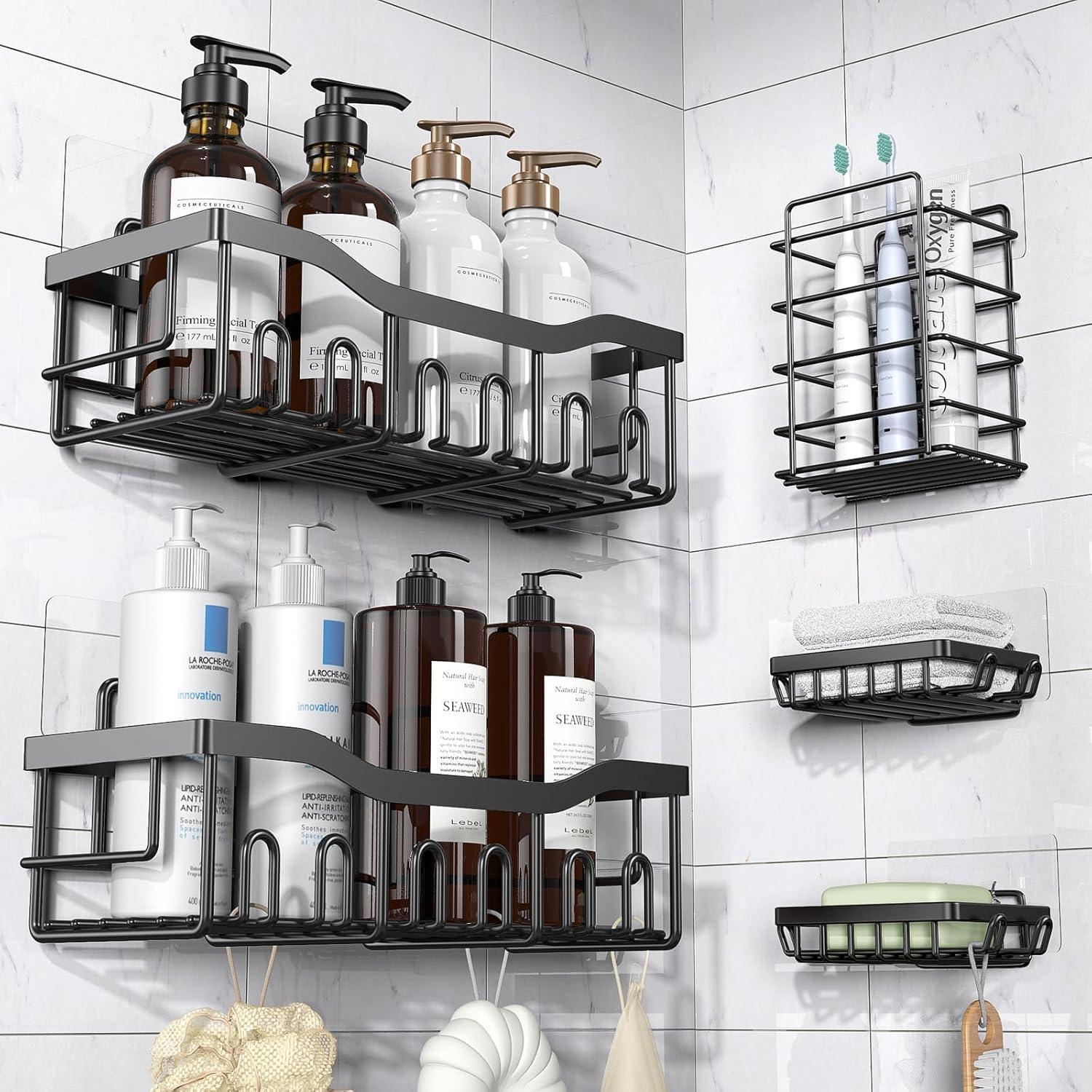 Sleek adhesive shower shelves on white marble tile holding toiletries, towels, soap, and bath accessories for a clean modern small bathroom storage setup.